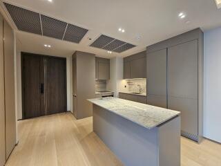Modern kitchen with island counter and wooden flooring
