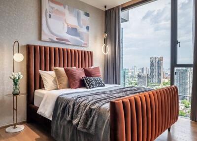 Modern bedroom with large window and city view