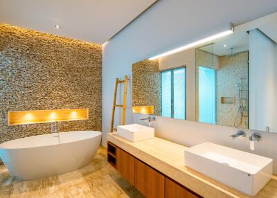 Modern bathroom with freestanding bathtub and dual sinks