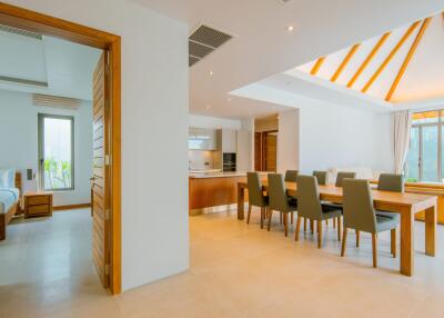 Spacious dining area with adjoining kitchen and bedroom