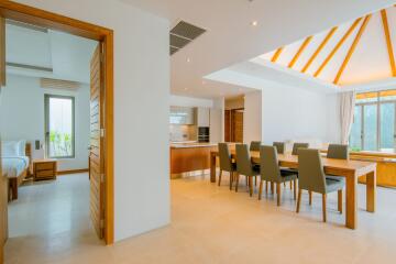 Spacious dining area with adjoining kitchen and bedroom