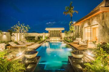 Luxurious outdoor swimming pool area at night