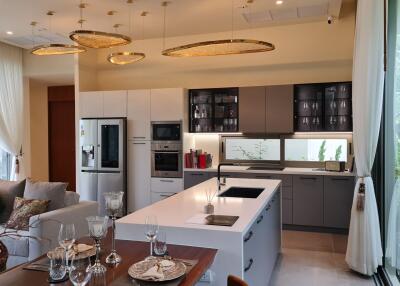 Modern kitchen with island, dining table, and appliances
