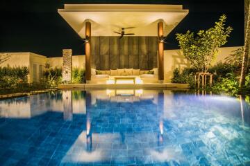 Luxurious outdoor pool area with modern cabana