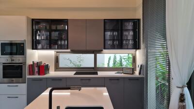 Modern kitchen with appliances and large window