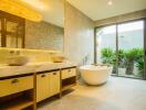 Modern bathroom with double vanity and freestanding bathtub