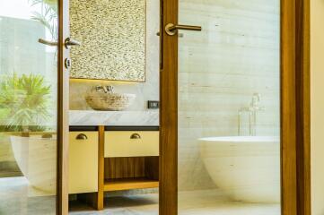 Modern bathroom with wooden accents and a freestanding bathtub