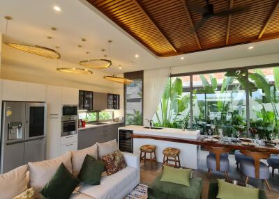 Open plan living area with kitchen and dining space