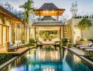 Luxury villa with pool and lush vegetation at twilight