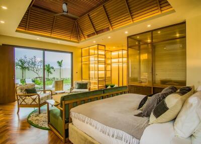 Spacious and modern master bedroom with outdoor view