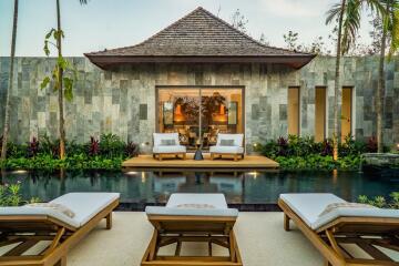 Beautiful outdoor seating area with pool and garden