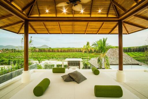 Open living area with wooden ceiling and scenic view