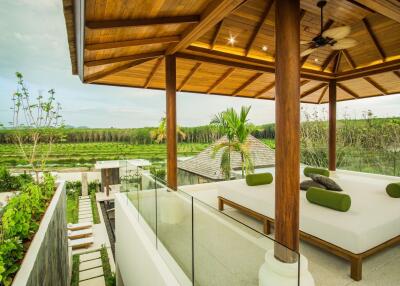 Outdoor seating area with wooden roof and scenic view