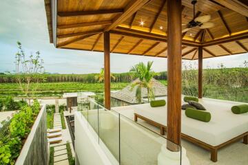 Outdoor seating area with wooden roof and scenic view