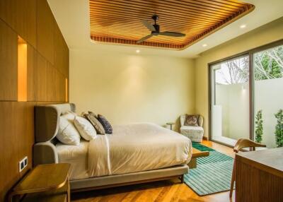 Spacious modern bedroom with a comfortable bed, large windows and a wooden ceiling