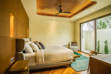 Spacious modern bedroom with a comfortable bed, large windows and a wooden ceiling