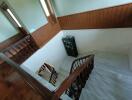 Wooden and marble staircase with decorative shelf