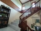 Wooden staircase with decorative cabinet