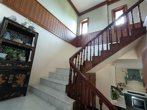 Wooden staircase with decorative cabinet