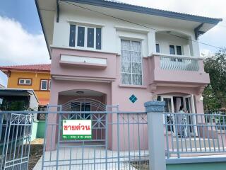 Exterior of a residential building with a gated front area