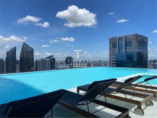 Rooftop infinity pool with skyline view