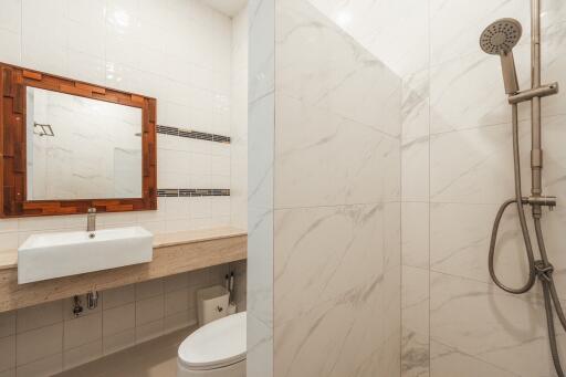 Modern bathroom with shower and large sink