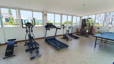 Spacious home gym with equipment