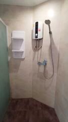 Bathroom with shower area and water heater