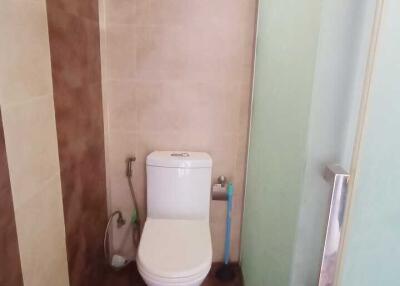 Compact bathroom with toilet and shower