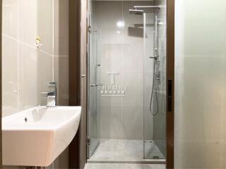 Modern bathroom with a glass-enclosed shower and sink