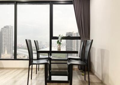 Modern dining room with large windows and city view