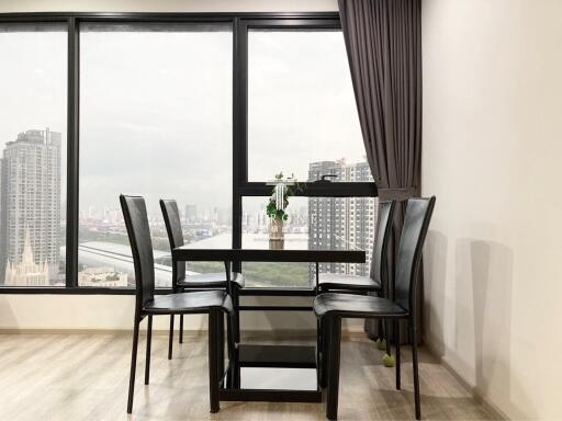 Modern dining room with large windows and city view