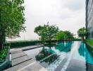 Outdoor swimming pool with surrounding trees and building