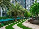 Modern residential building with outdoor pool and lounge area