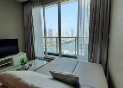 Bright living room with large window and city view