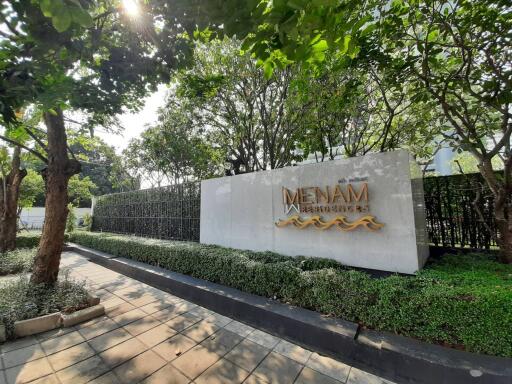 Building entrance with Menam Residences sign