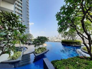 Modern building with rooftop pool and city view