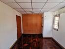 Bedroom with wooden flooring and built-in wardrobe