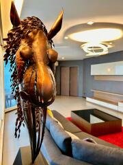 Modern living room with artistic horse sculpture