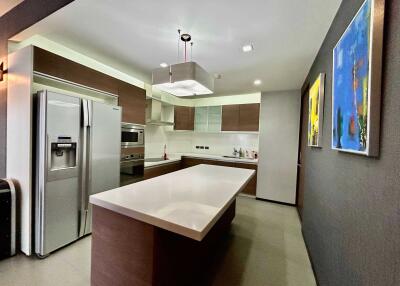 Modern kitchen with stainless steel appliances and island