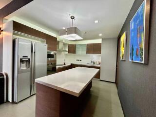 Modern kitchen with stainless steel appliances and island