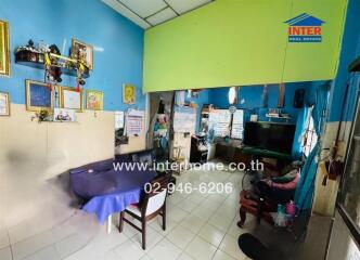 Living room with blue walls and various decorations