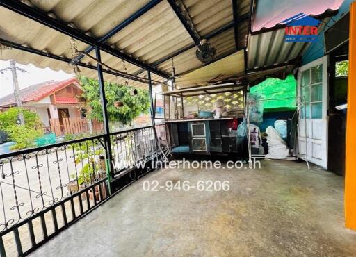 Covered patio area with railing
