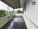 Spacious covered balcony with tiled flooring