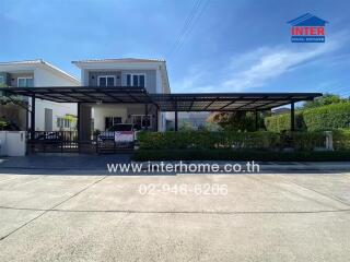 Modern two-story house with carport