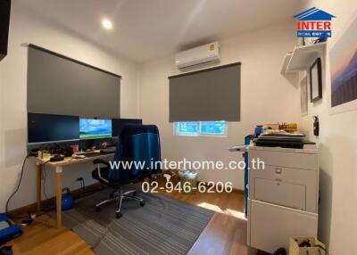 Modern home office with window blinds and air conditioning