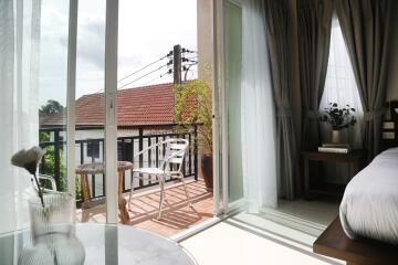 Bright and airy bedroom with balcony and natural light