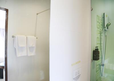 Modern bathroom with a shower and towel rack