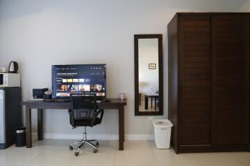 Bedroom with work desk and wardrobe