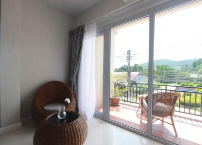 Bright living area with large sliding glass doors leading to a balcony